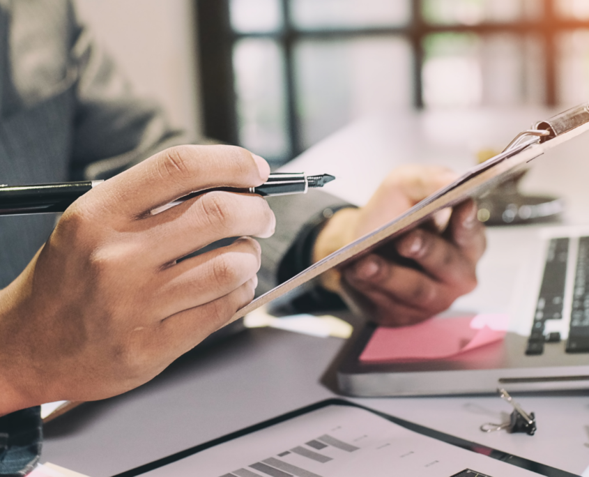 Experience Intelligence person looking through notes and reports